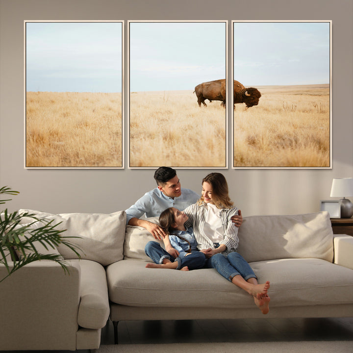 A lone bison standing in a vast golden grassland under a soft blue sky, evoking a rustic and Western aesthetic, ideal for farmhouse decor.