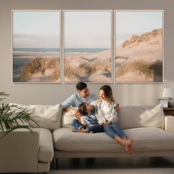 Soft pastel-toned beach scene with sand dunes, windswept grasses, and a calm ocean horizon, creating a serene coastal atmosphere.