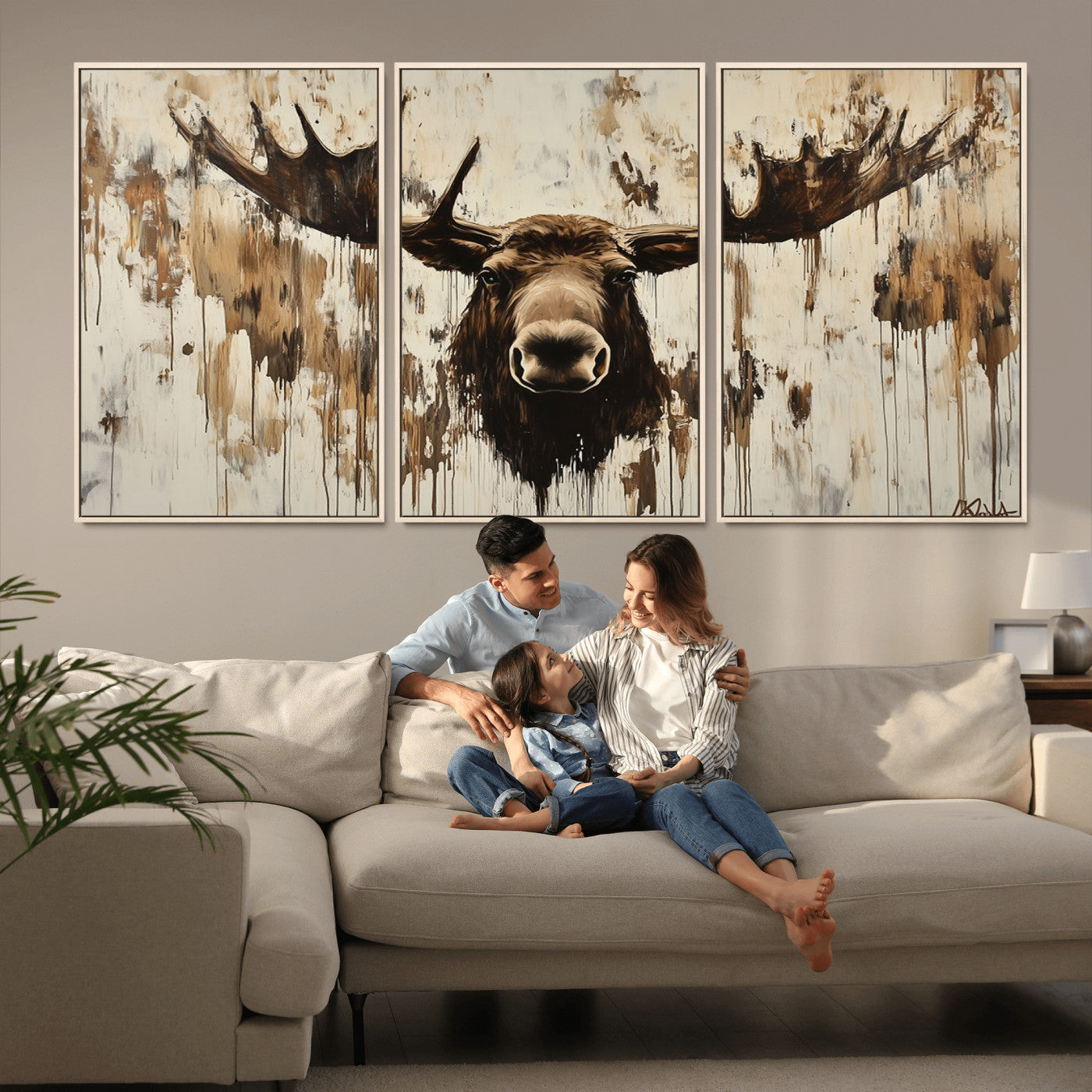 Expressive painting of a moose head with wide antlers in dark brown and beige tones, featuring paint drips and splatters on a light textured background, creating a striking rustic wall art canvas.