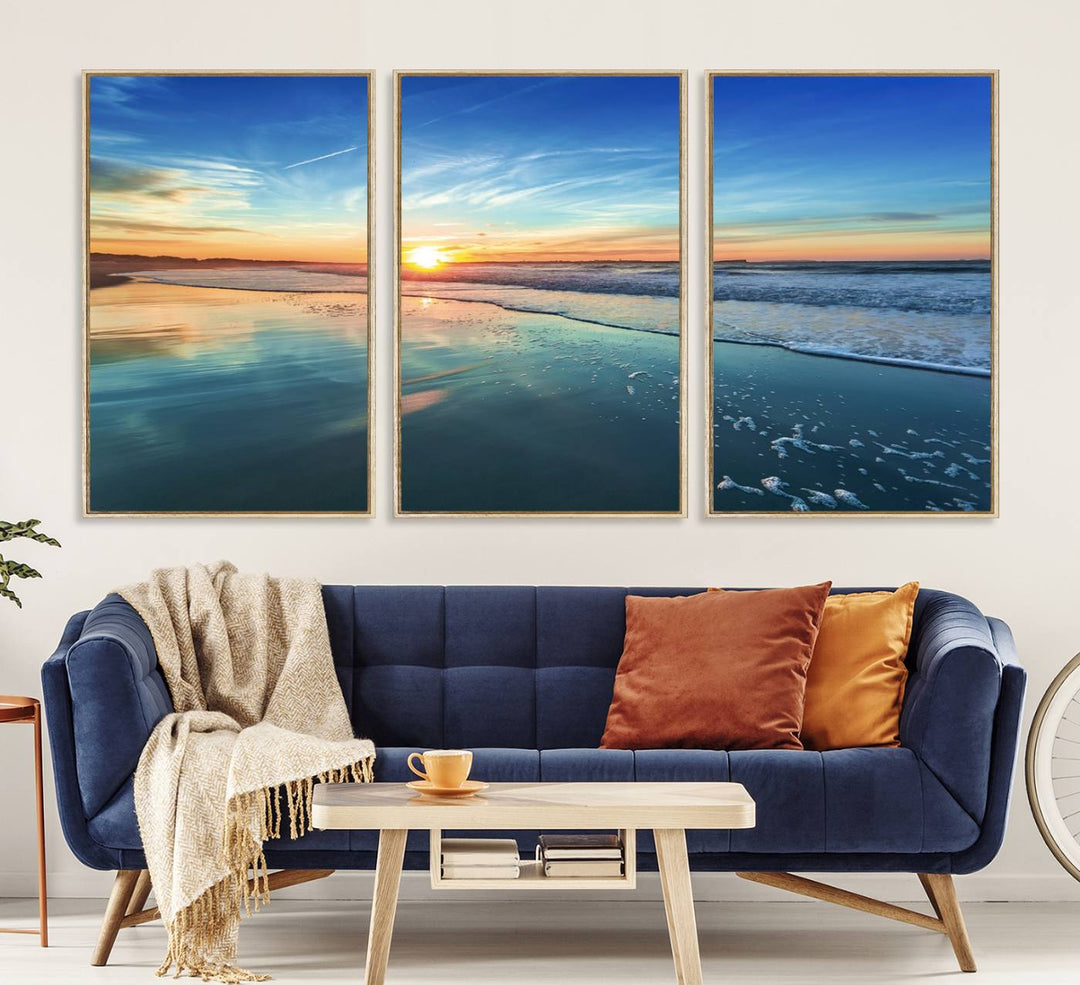 The Blue Sky and Beach Wall Art Canvas Print features a vibrant orange sky reflecting on wet sand.