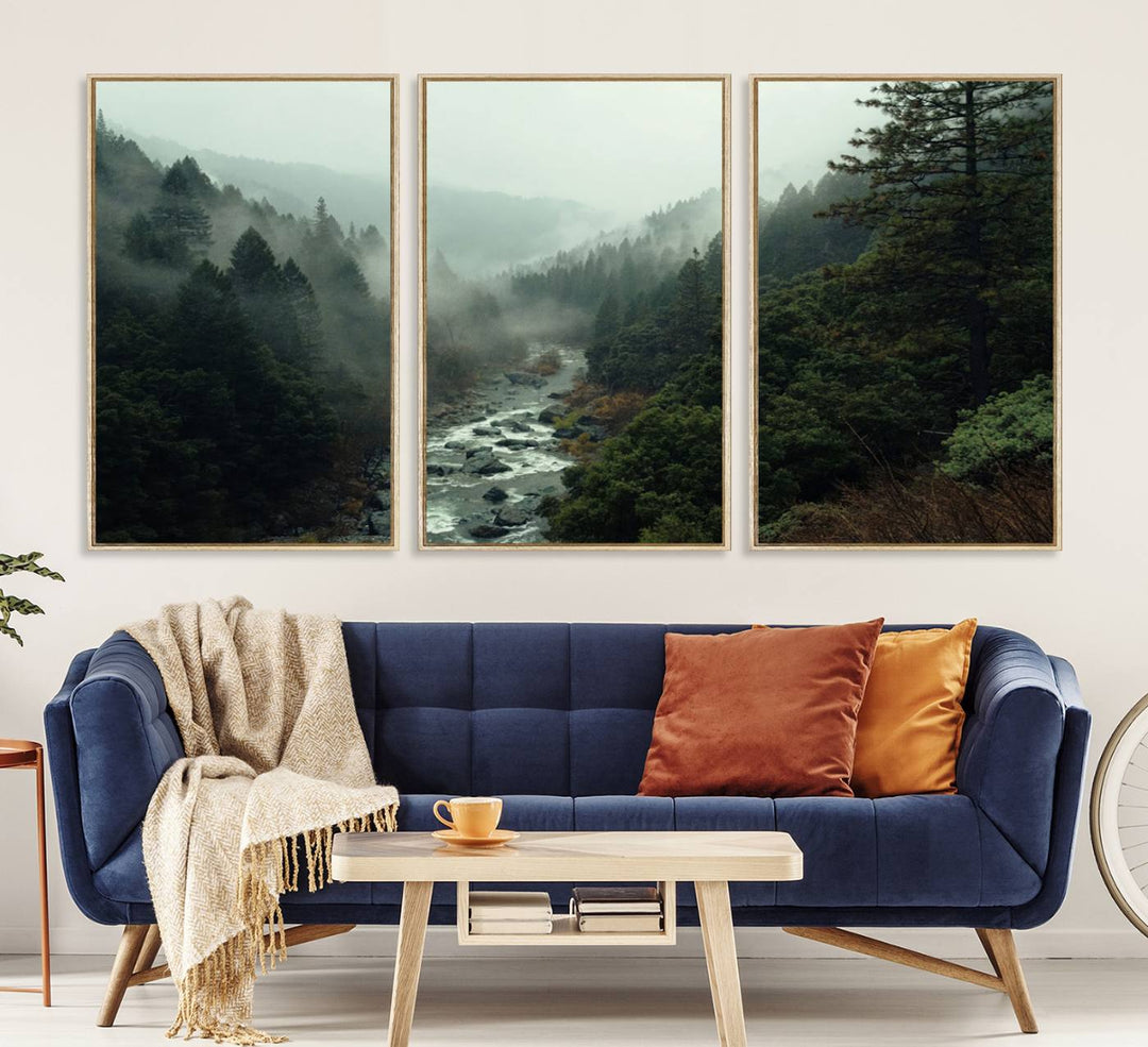 The Misty Forest Wall Art features a serene landscape with a misty river and evergreens, ideal for enhancing the ambiance of any living room or cabin.