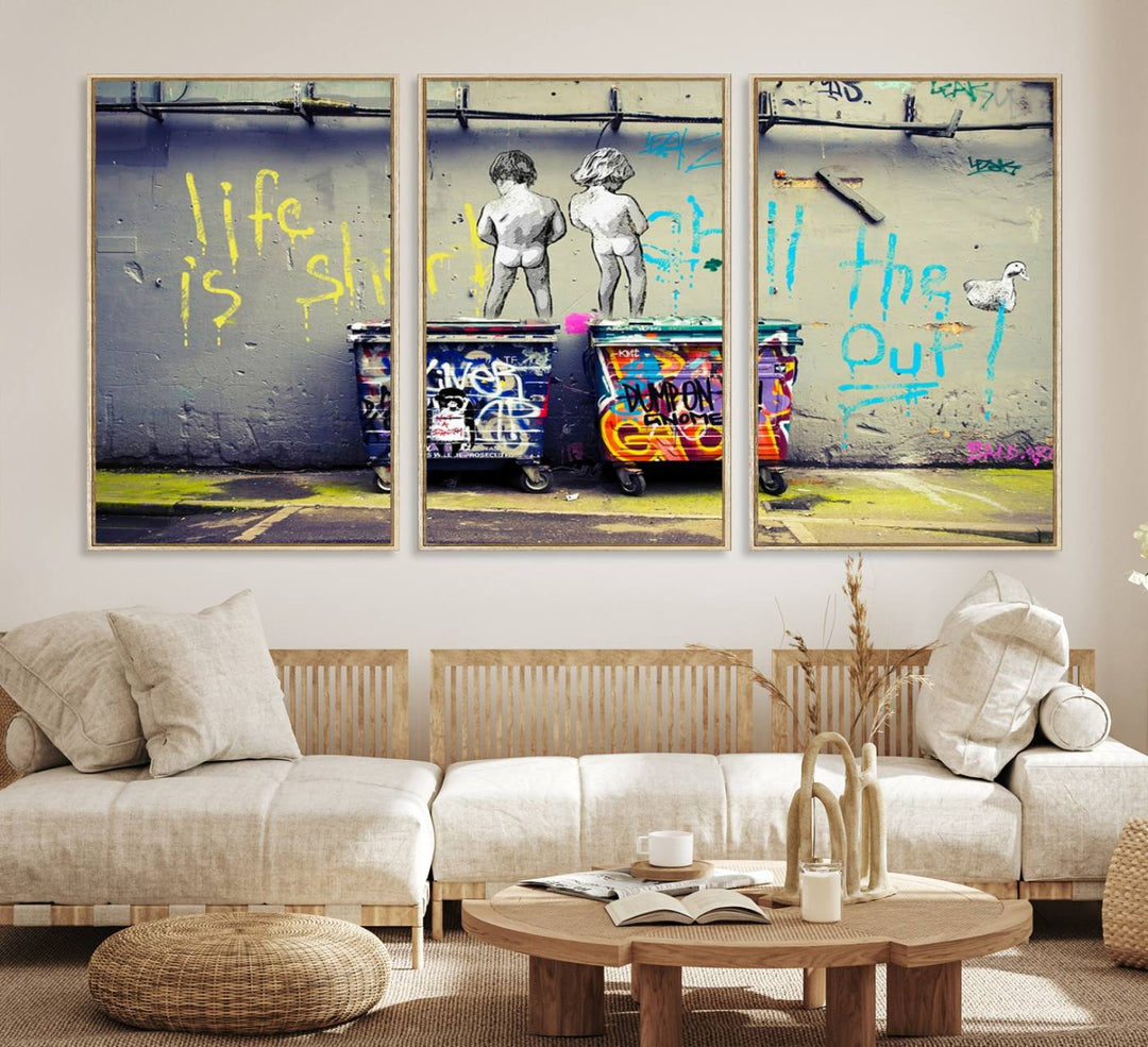 Banksys Life is Short graffiti, featuring kids and text, decorates the wall as a striking piece of framed canvas art.