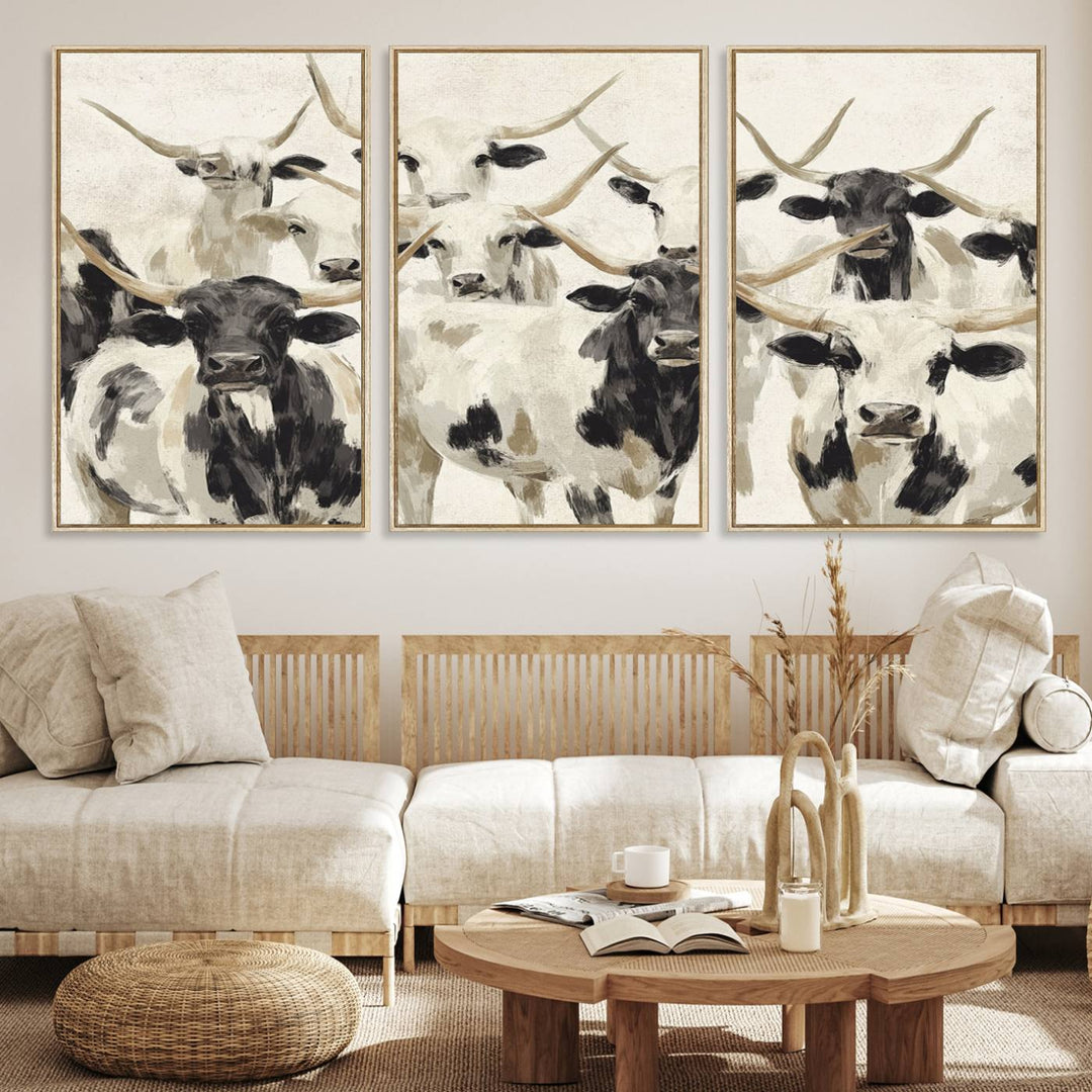 Canvas print titled Longhorn Texas Cow Drawing, depicting longhorn cattle with black and white markings, made in the USA, displayed on the wall.