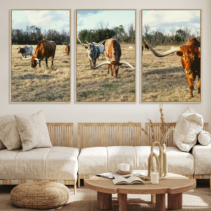 A herd of Texas Longhorn cattle grazing in an open field under a partly cloudy sky, capturing a rustic and Western ranch aesthetic.