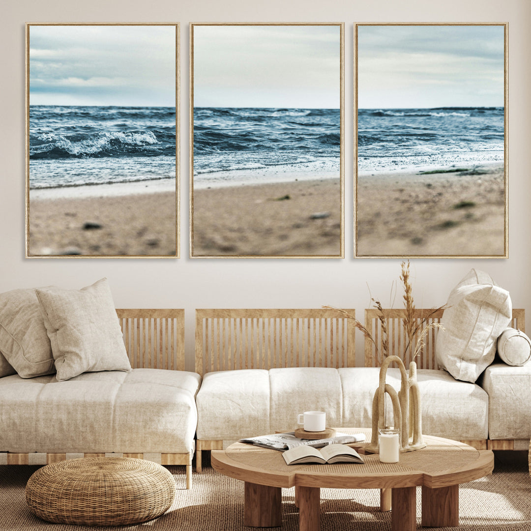 A moody ocean scene with gentle waves washing onto a sandy beach under a cloudy sky, creating a peaceful and coastal atmosphere.