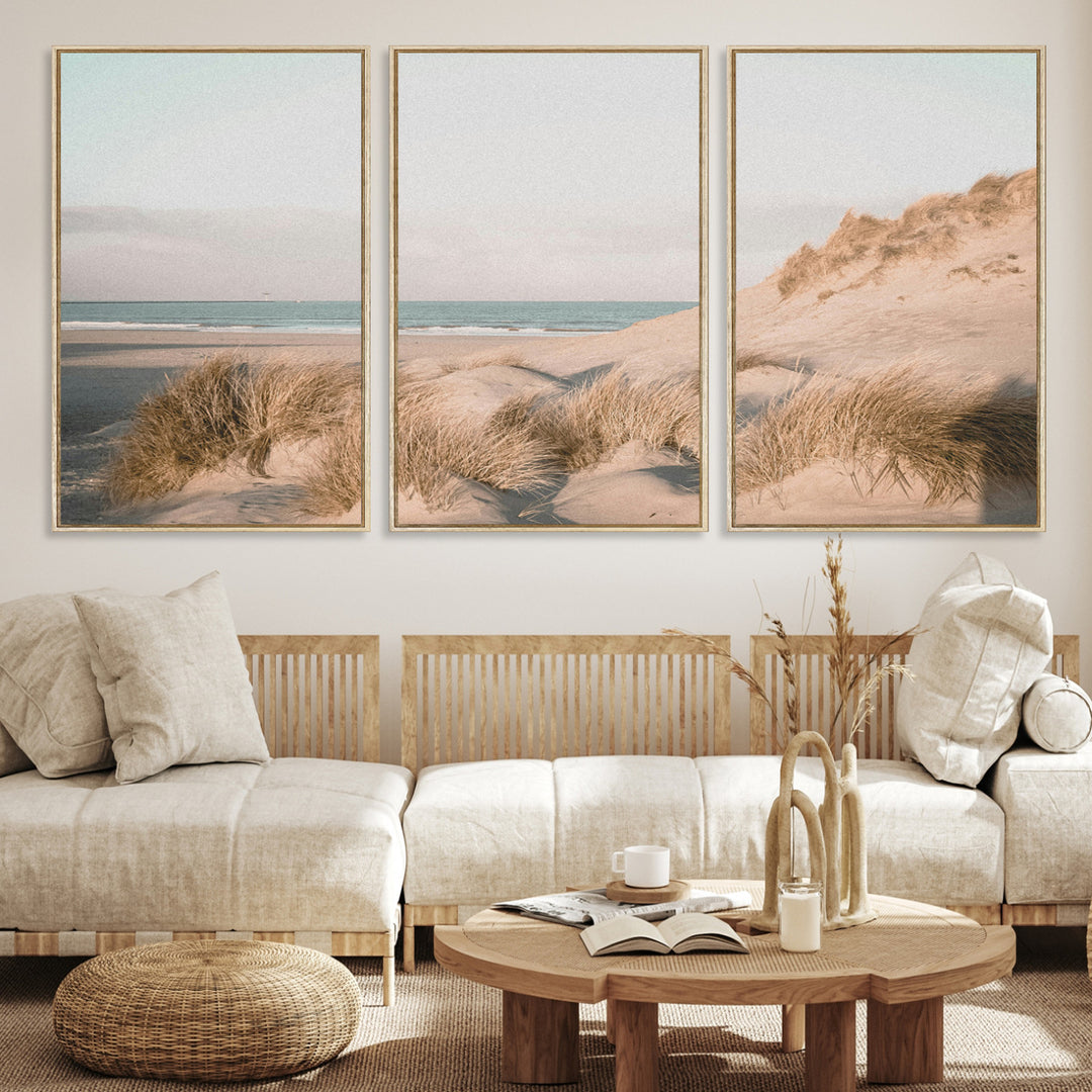 Soft pastel-toned beach scene with sand dunes, windswept grasses, and a calm ocean horizon, creating a serene coastal atmosphere.