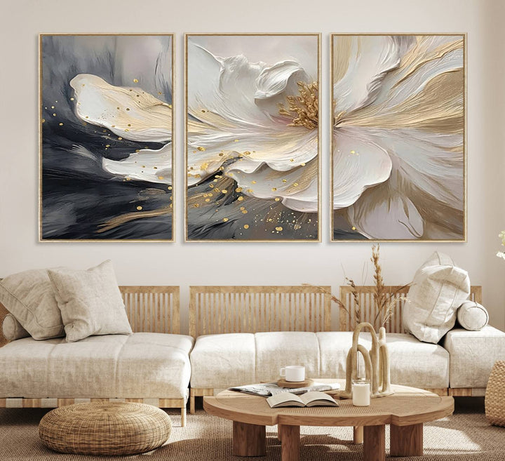 Elegant White and Gold Floral Triptych Canvas Art, a modern textured flower painting for home or office decor, features a blurred gray background.