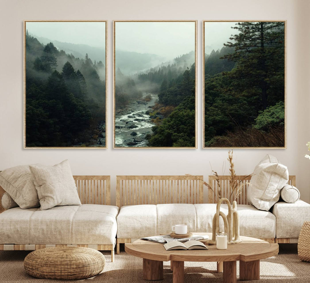 The Misty Forest Wall Art features a serene landscape with a misty river and evergreens, ideal for enhancing the ambiance of any living room or cabin.