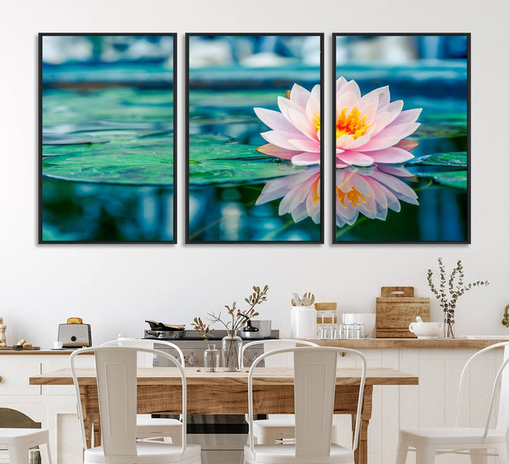 The Lotus Flower Canvas Print showcases a pink water lily with a yellow center gracefully floating on a calm pond.