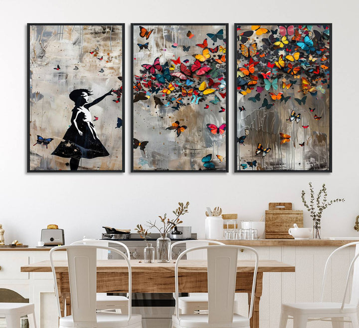 The Banksy Butterfly Girl 3-Piece Modern Graffiti Canvas Wall Art features a silhouette of a girl reaching for butterflies.