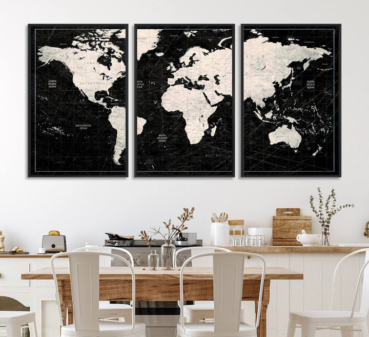 A bold global style framed black and white world map canvas print, presented in three panels, perfect for modern home or office decor.