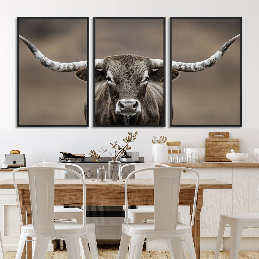 A close-up of a longhorn bull facing forward is featured in the Framed Texas Test-1, set against a blurred brown background.