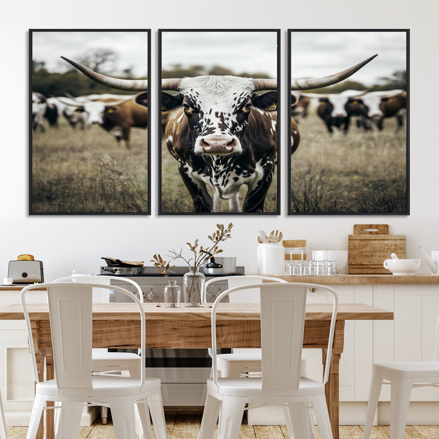 Canvas of a speckled Texas longhorn standing boldly in a field with a herd behind, perfect for rustic western or farmhouse wall decor.