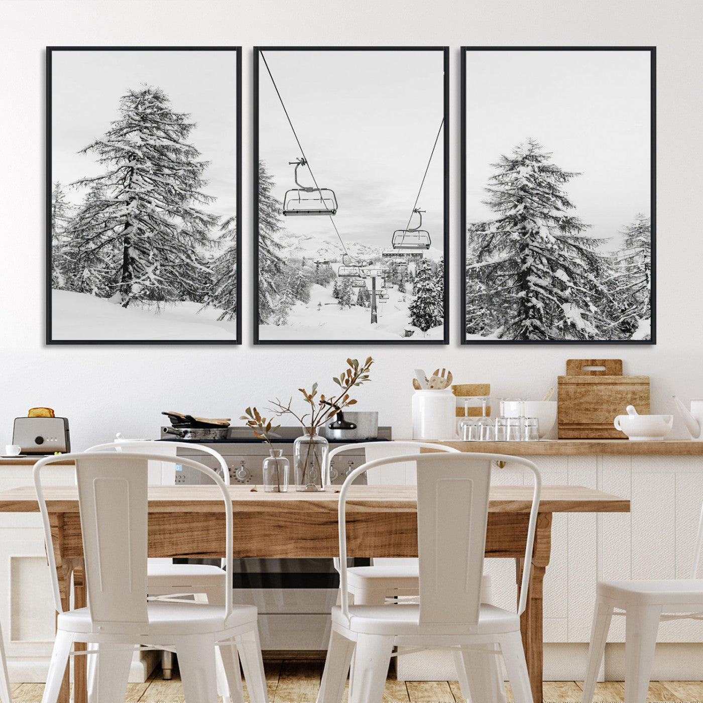 Black and white image of a ski lift amidst snow-covered pine trees, ideal for winter mountain or cabin-themed decor.