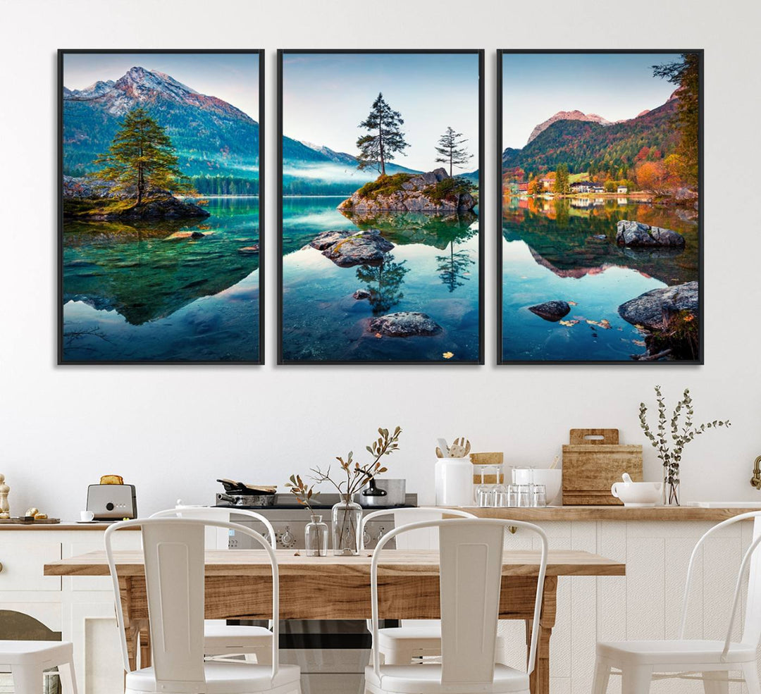 The 3-panel wall art showcases a serene mountain lake with rocky islands and trees, creating an ideal focal point for dining rooms or offices.