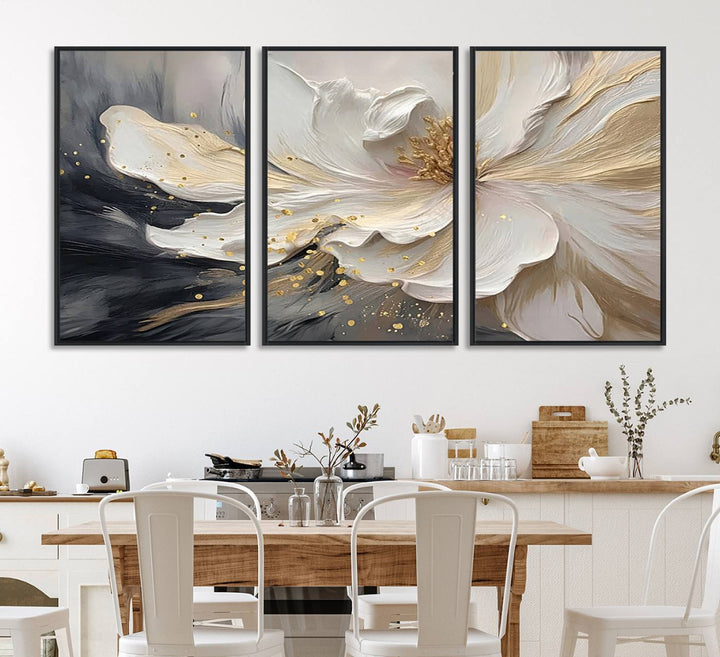 Elegant White and Gold Floral Triptych Canvas Art, a modern textured flower painting for home or office decor, features a blurred gray background.