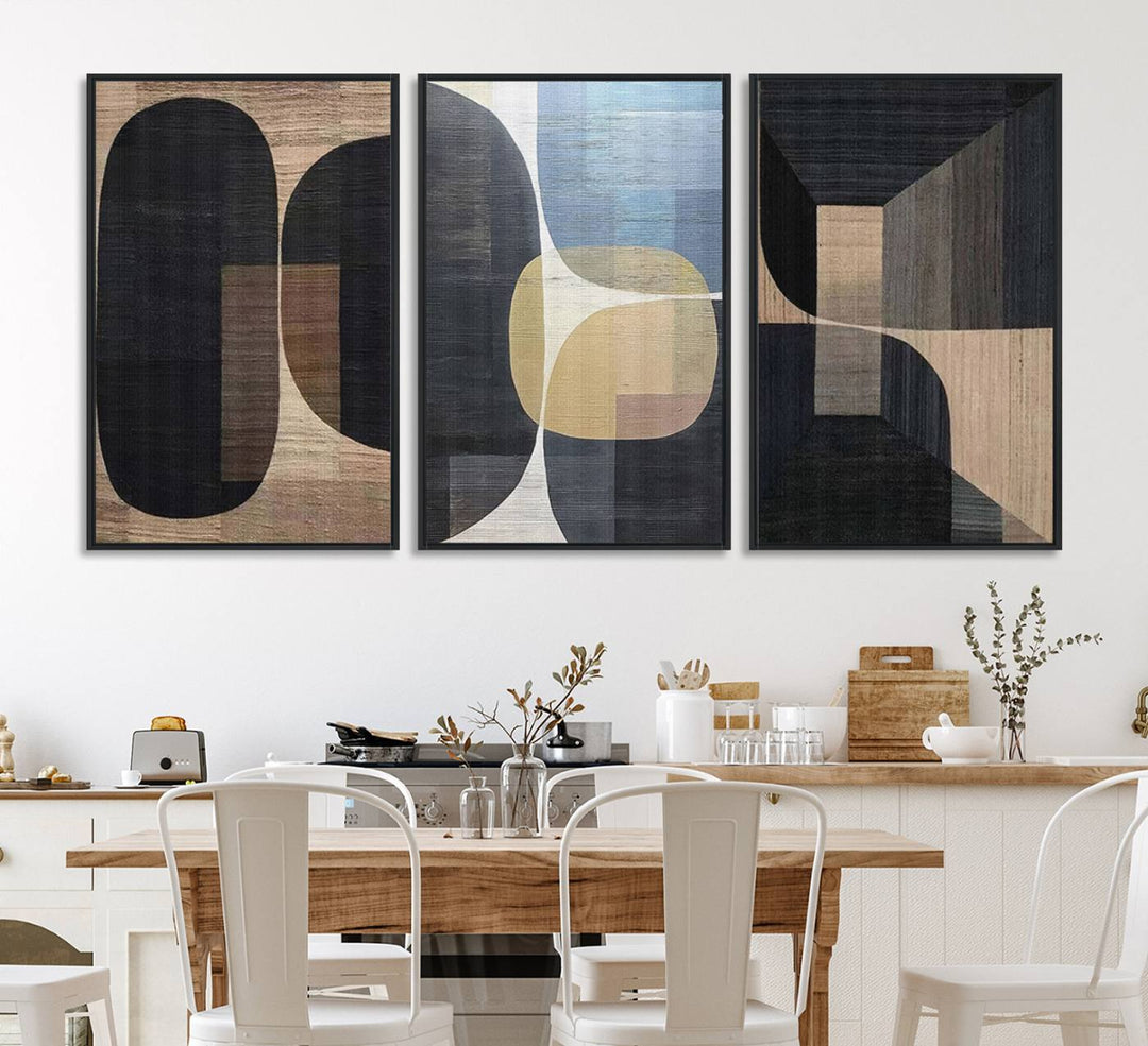 Abstract geometric wall art featuring black, gray, beige, and blue tones framed in a wooden border.