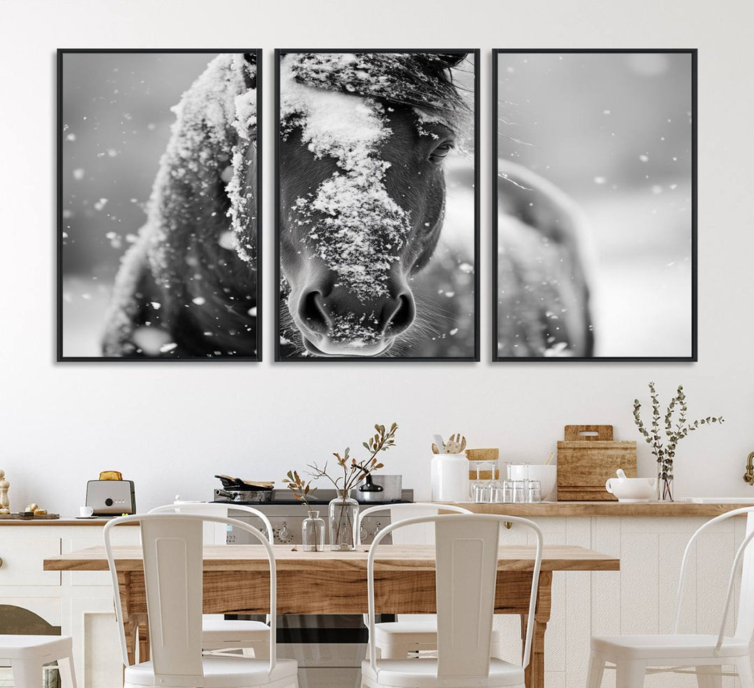 The Black and White Horse Winter Wall Art features a majestic horse with snow-covered hair set against a serene winter backdrop.