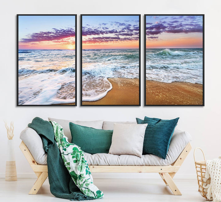 The Coastal Sunset Art Canvas Print features ocean waves beneath a vibrant sky in a stunning 3-panel seascape.