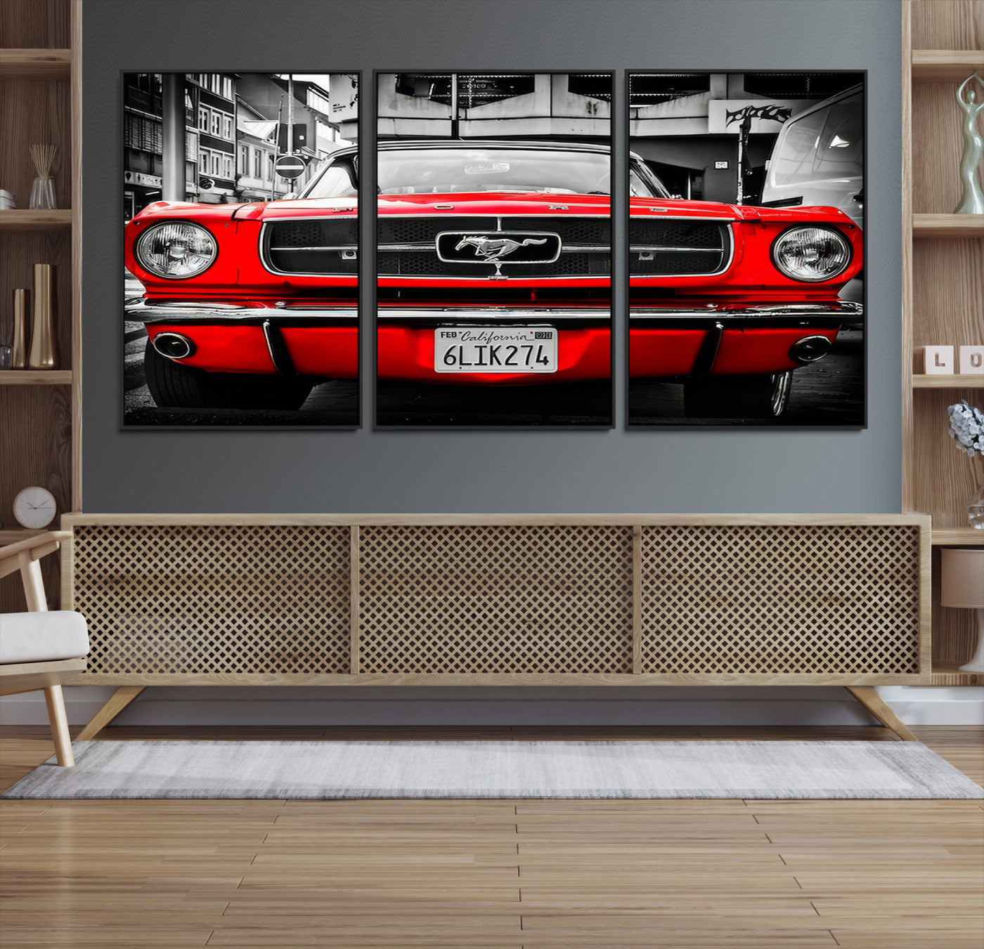 Front view of a bold red 1960s Ford Mustang parked in an urban environment, captured in dramatic contrast with a black-and-white city backdrop, emphasizing its timeless American muscle car identity.