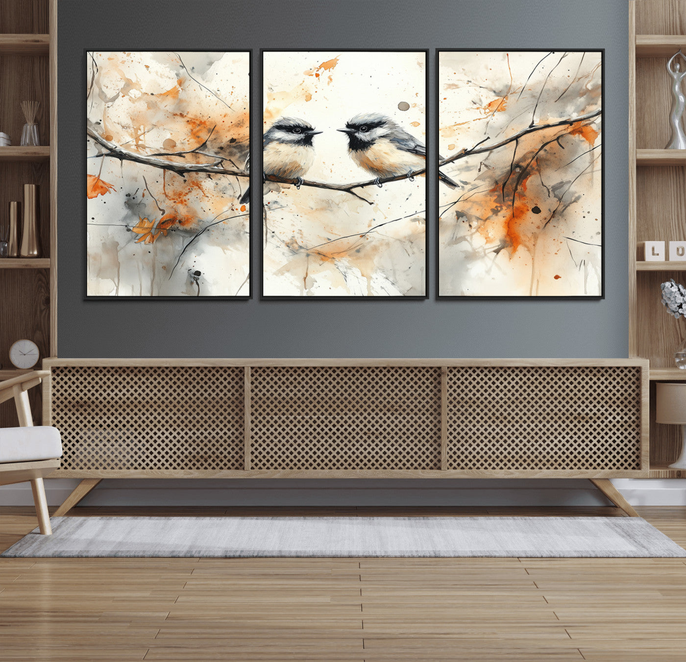 A soft and elegant watercolor painting of two chickadees perched on a delicate branch, surrounded by splashes of orange and neutral tones evoking a calm autumn day.