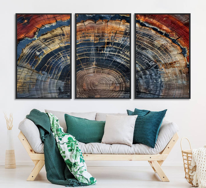 The Abstract Tree Ring Wall Art in orange, blue, and gray perfectly complements minimalist nature-inspired home decor.