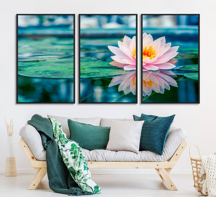 The Lotus Flower Canvas Print showcases a pink water lily with a yellow center gracefully floating on a calm pond.