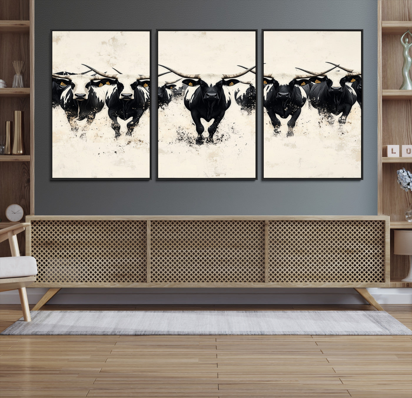 Canvas artwork of black and white Texas longhorns in a bold stampede over a minimalist background, ideal for rustic modern or Western-themed decor.