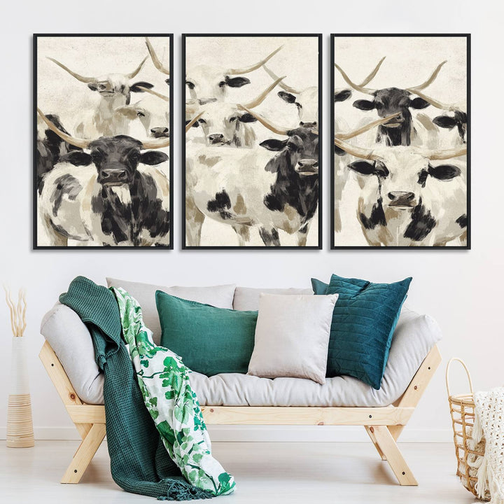 Canvas print titled Longhorn Texas Cow Drawing, depicting longhorn cattle with black and white markings, made in the USA, displayed on the wall.