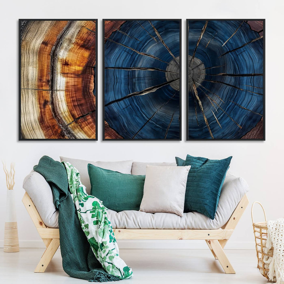 The Abstract Tree Rings Canvas Print features blue, brown, and orange rings that highlight wood grain and natures beauty.