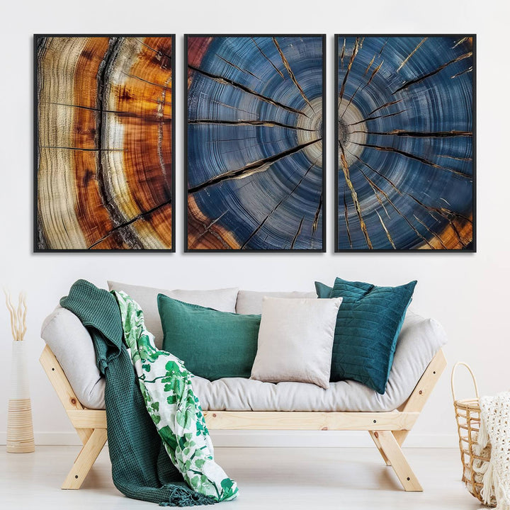 Close-up of blue, brown, and orange wood grain rings on the Abstract Tree Rings Canvas Wall Art Print.