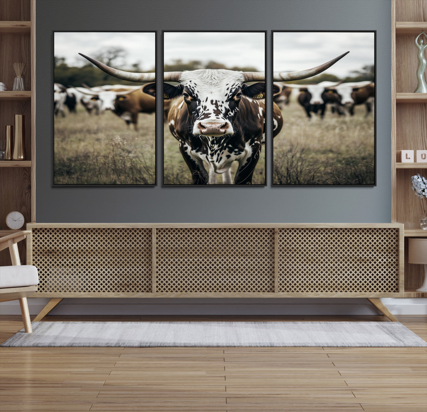 Canvas of a speckled Texas longhorn standing boldly in a field with a herd behind, perfect for rustic western or farmhouse wall decor.