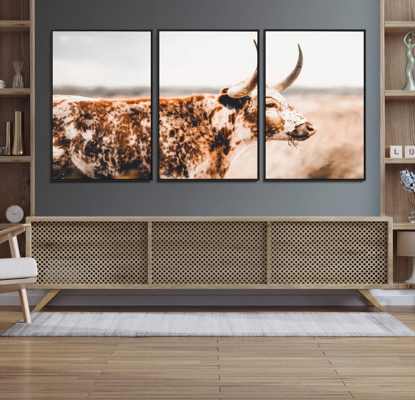Speckled Texas longhorn with curved horns standing in a warm-toned prairie, perfect for rustic or country-style home decor.