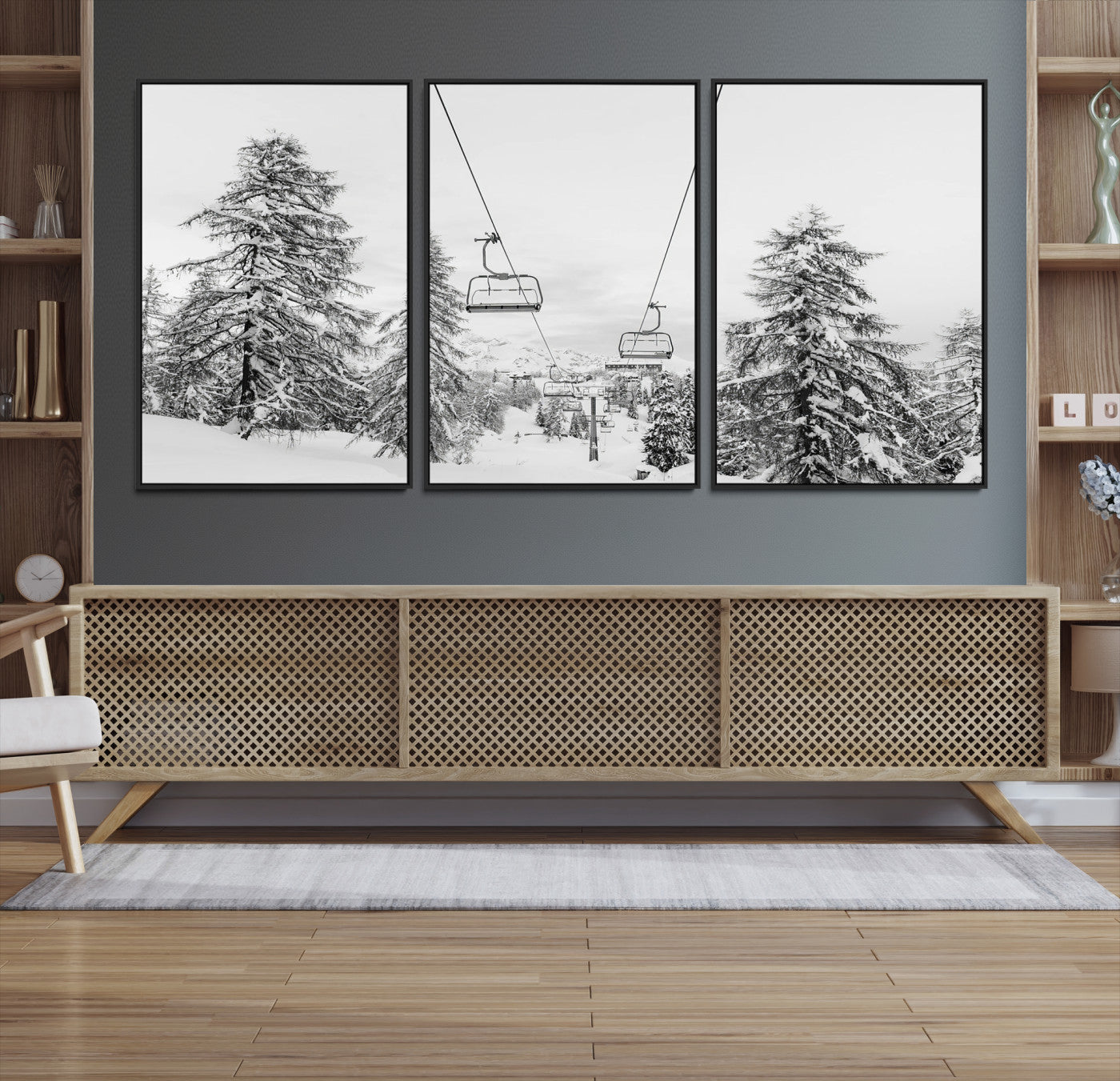 Black and white image of a ski lift amidst snow-covered pine trees, ideal for winter mountain or cabin-themed decor.