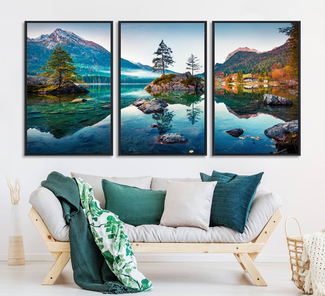 The 3-panel wall art showcases a serene mountain lake with rocky islands and trees, creating an ideal focal point for dining rooms or offices.