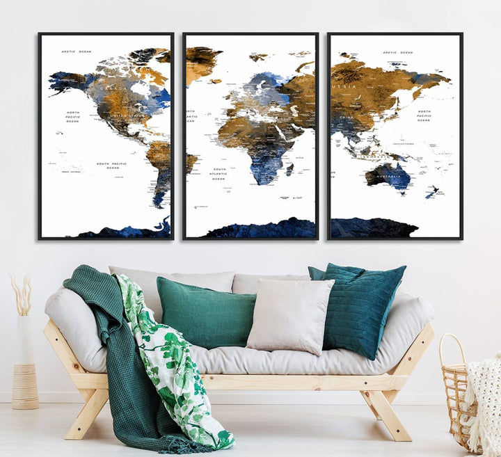 The Triptych Modern World Map Canvas in blue and brown is an ideal global decor piece for enhancing living rooms or offices. It comes ready to hang.