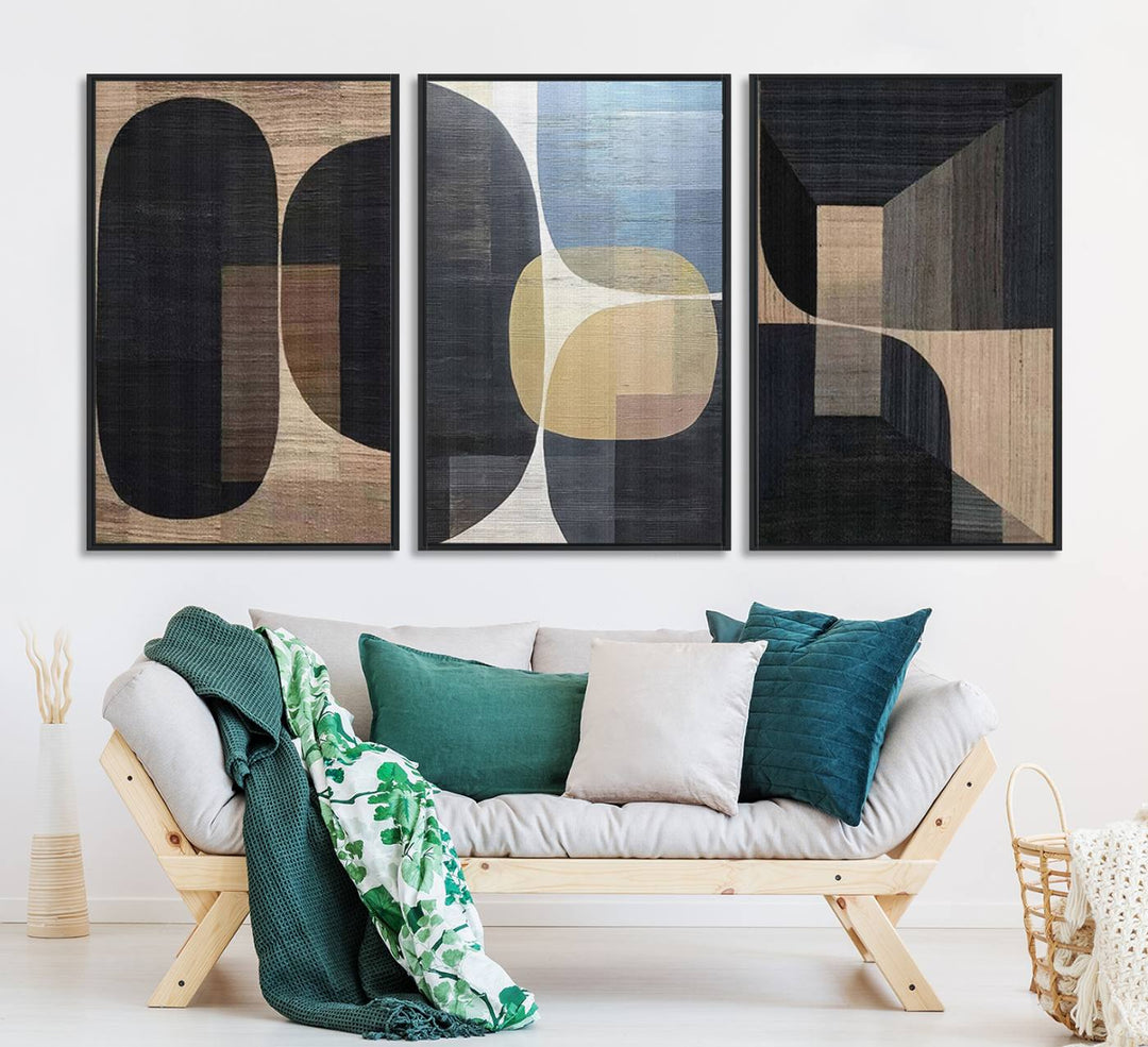 Abstract geometric wall art featuring black, gray, beige, and blue tones framed in a wooden border.