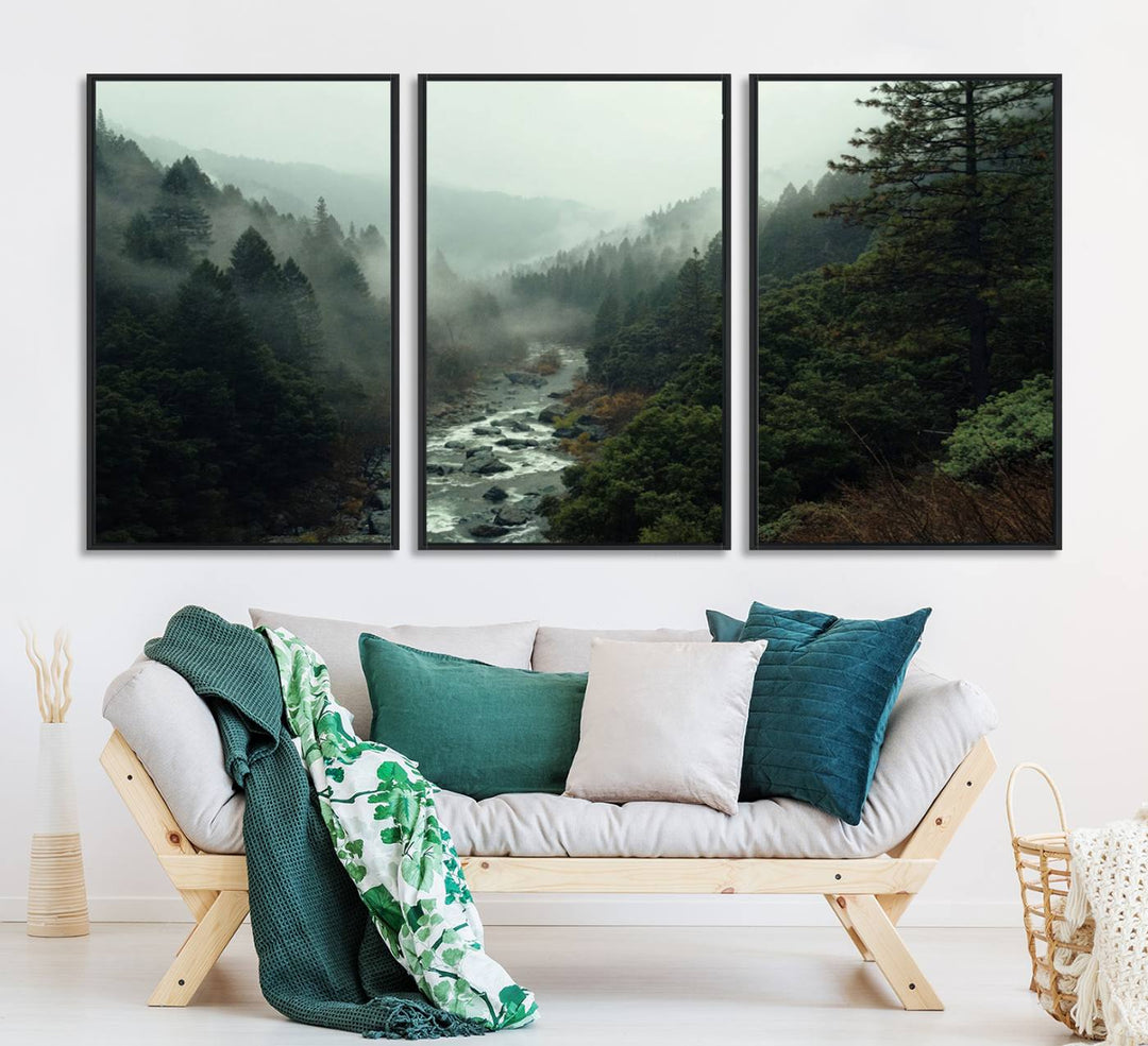 The Misty Forest Wall Art features a serene landscape with a misty river and evergreens, ideal for enhancing the ambiance of any living room or cabin.