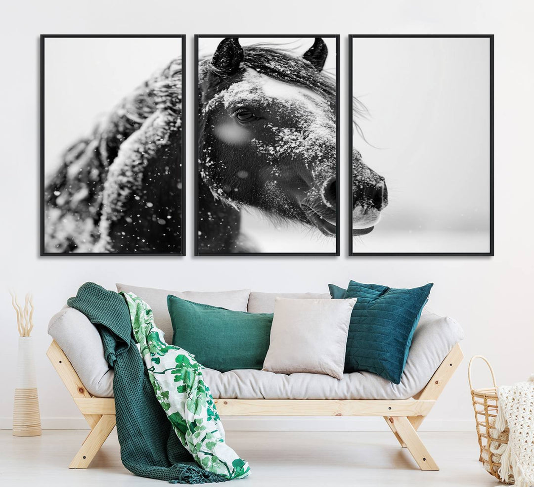 A large 3-panel rustic farmhouse wall art showcases a black and white winter horse canvas print against a snowy backdrop.