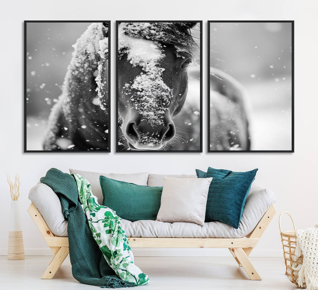 The Black and White Horse Winter Wall Art features a majestic horse with snow-covered hair set against a serene winter backdrop.