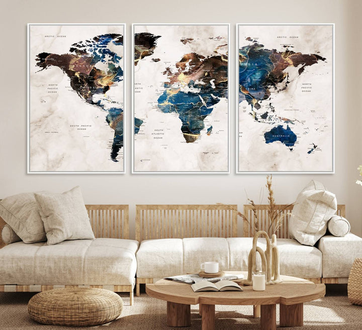 Abstract earth-toned 3-panel world map wall art featuring blues and browns, ready to hang; it showcases continents on modern canvas.