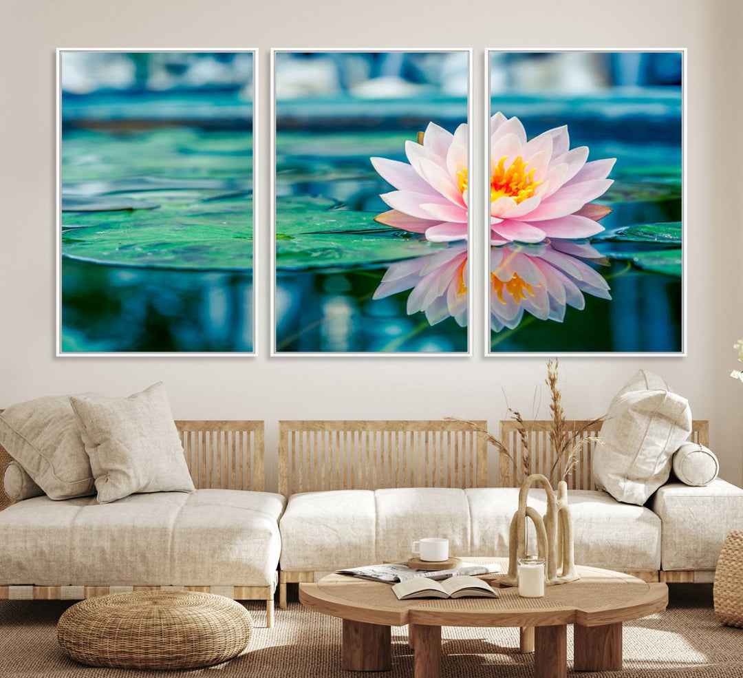 The Lotus Flower Canvas Print showcases a pink water lily with a yellow center gracefully floating on a calm pond.