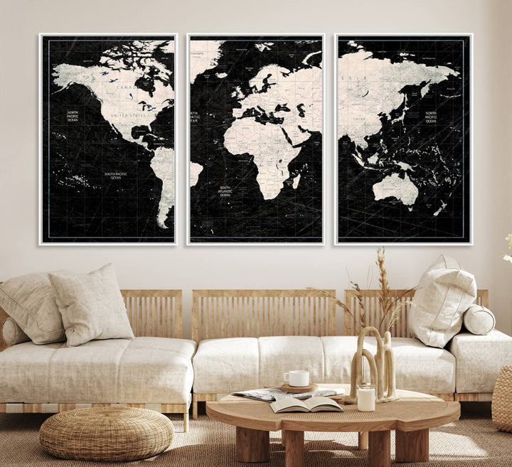 A bold global style framed black and white world map canvas print, presented in three panels, perfect for modern home or office decor.