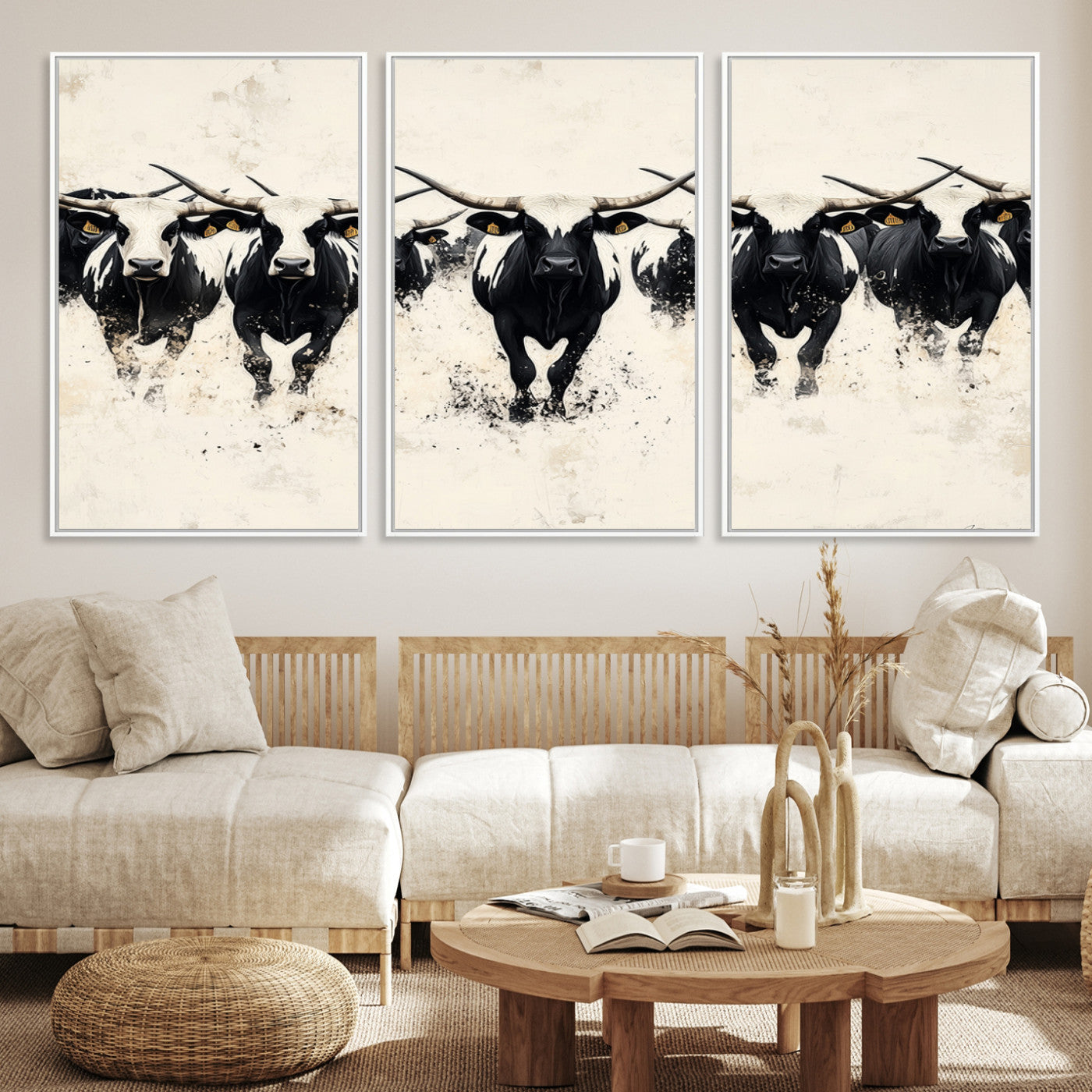Canvas artwork of black and white Texas longhorns in a bold stampede over a minimalist background, ideal for rustic modern or Western-themed decor.