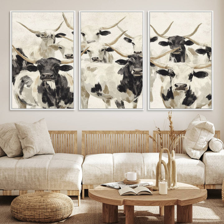 Canvas print titled Longhorn Texas Cow Drawing, depicting longhorn cattle with black and white markings, made in the USA, displayed on the wall.