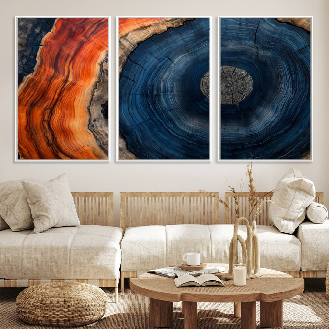 Abstract Tree Ring Wall Art Print on canvas featuring vibrant blue, orange, and brown rings with a natural rustic wood texture. Free shipping available!.