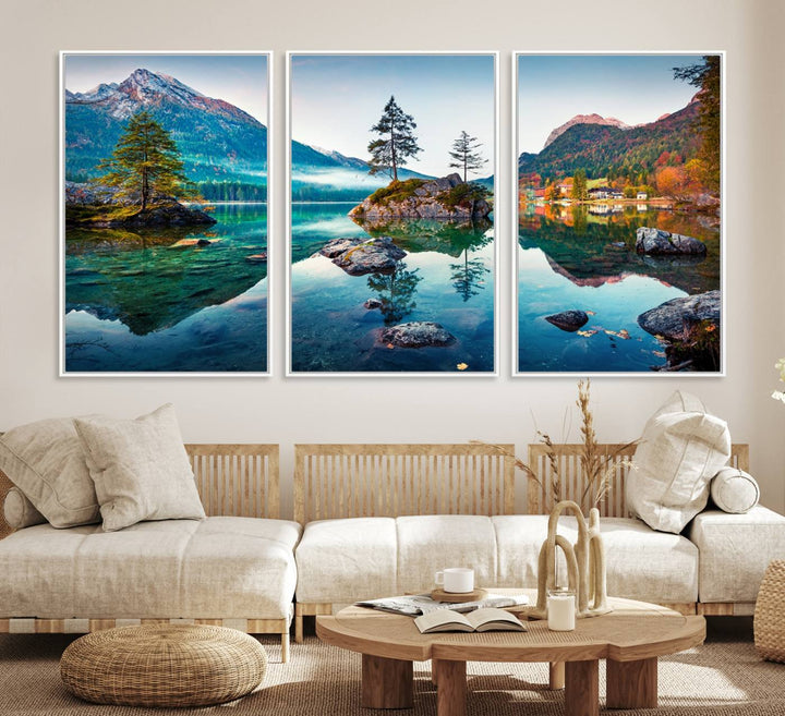 The 3-panel wall art showcases a serene mountain lake with rocky islands and trees, creating an ideal focal point for dining rooms or offices.