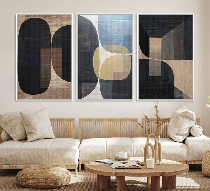 Abstract geometric wall art featuring black, gray, beige, and blue tones framed in a wooden border.