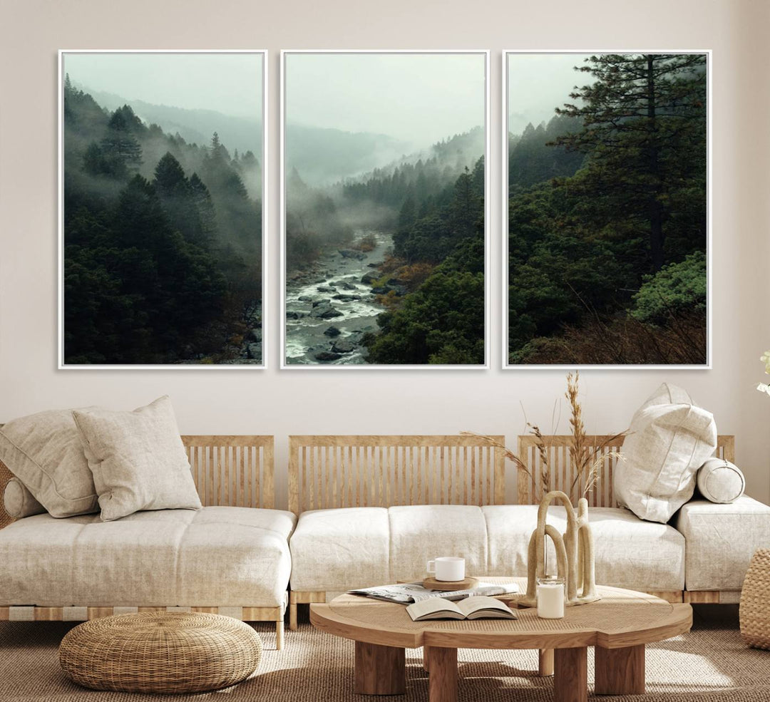 The Misty Forest Wall Art features a serene landscape with a misty river and evergreens, ideal for enhancing the ambiance of any living room or cabin.