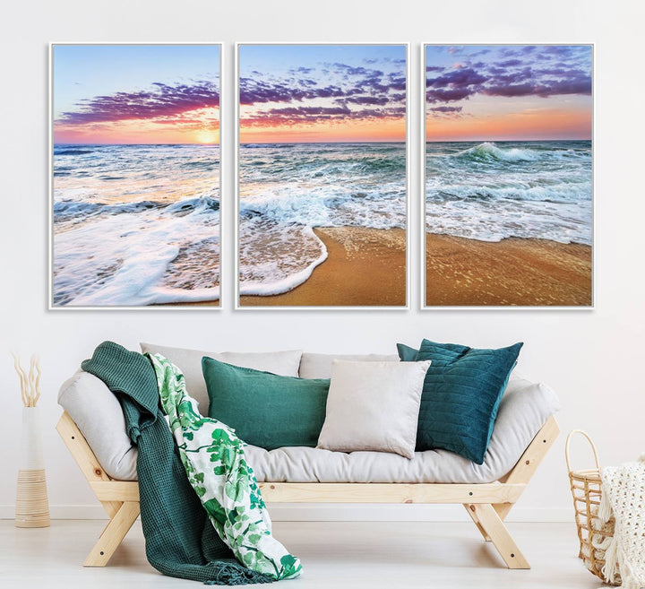 The Coastal Sunset Art Canvas Print features ocean waves beneath a vibrant sky in a stunning 3-panel seascape.